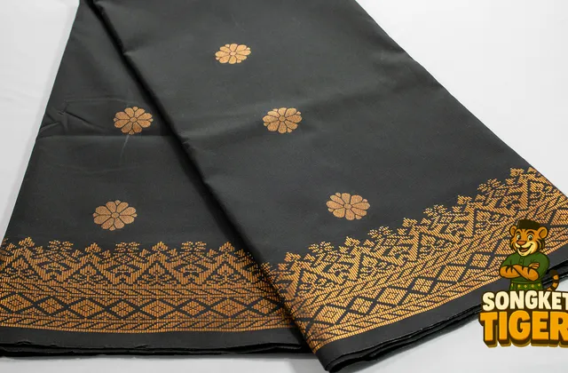 Songket fabric with metallic gold thread motif detail