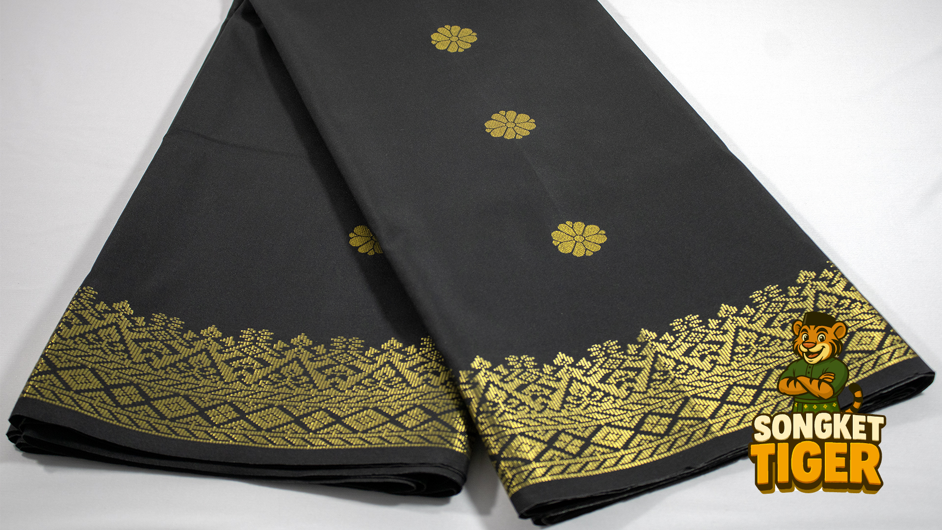 Songket Pahang with bunga tabur motif — gold thread on maroon silk