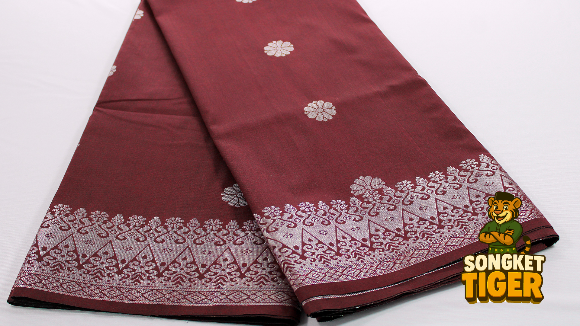 Traditional sampin songket worn with Baju Melayu