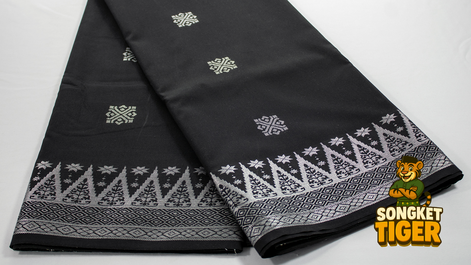 White songket with subtle silver thread embroidery