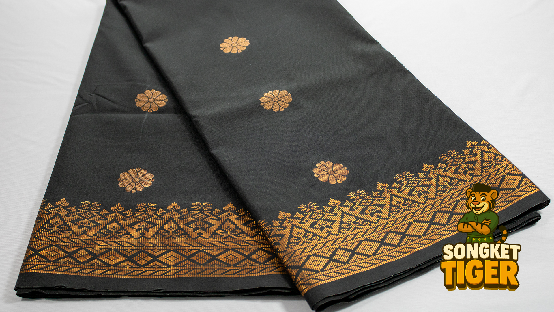 Dark grey songket with minimalist gold dot pattern