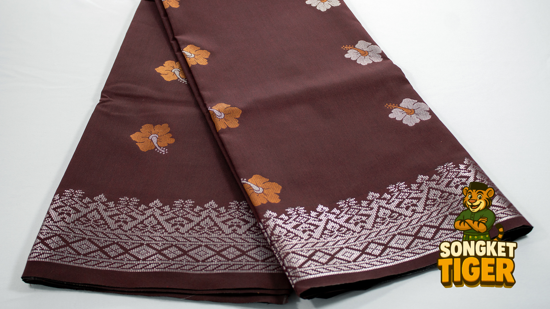 Crimson songket with royal crown and peacock motifs